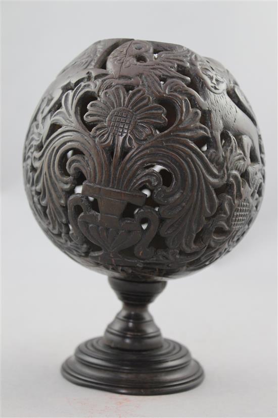 A 19th century carved and pierced coconut cup or goblet, 7.25in.